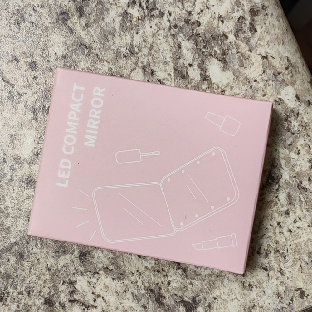 Light up pink compact mirror
